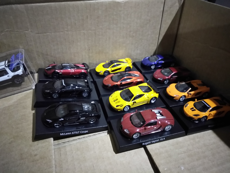 Here are some or my 7-Eleven Paganis and McLarens mixed in with some Kyosho cars.